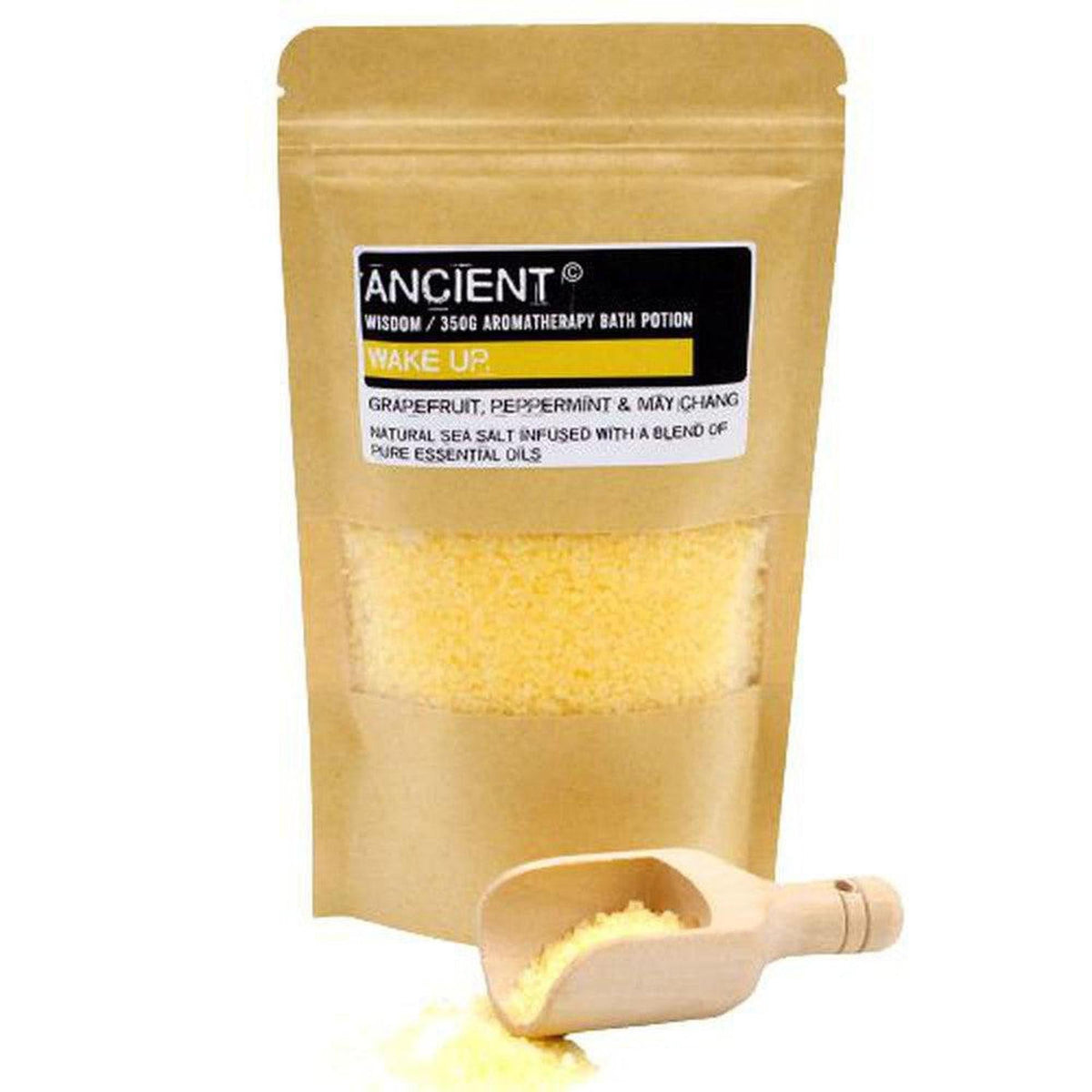 350g Wake Up sea salt bath potion in a brown kraft pouch with a wooden scoop of yellow salt crystals.