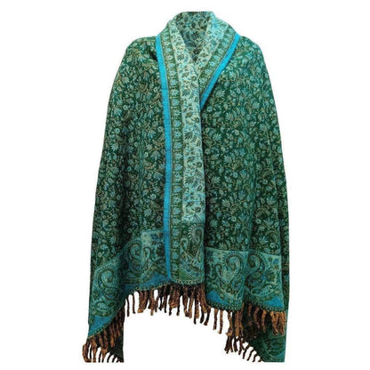 Green yak wool shawl featuring intricate floral paisley patterns, a contrasting teal border, and dark fringed edges.