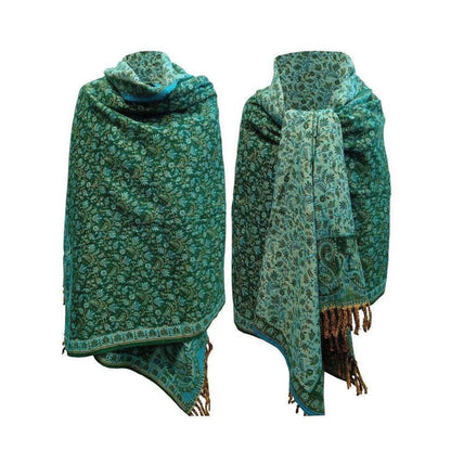 Emerald green yak wool shawl featuring intricate floral paisley patterns and decorative fringe edges.
