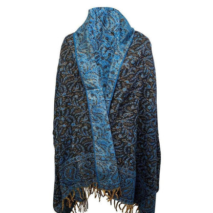 Handcrafted yak wool shawl in black and blue with intricate floral paisley patterns and fringed edges.