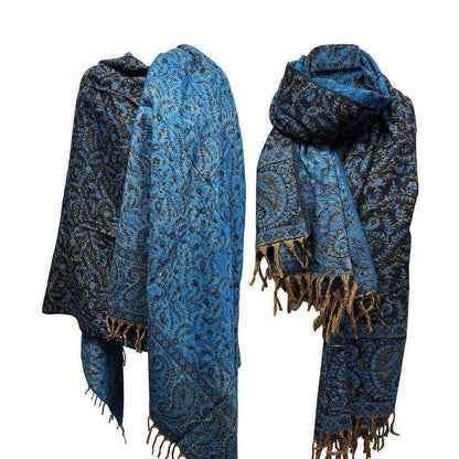Luxurious blue and black yak wool shawl featuring intricate paisley patterns and decorative fringe edges.